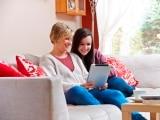 Mother and daughter share a tablet